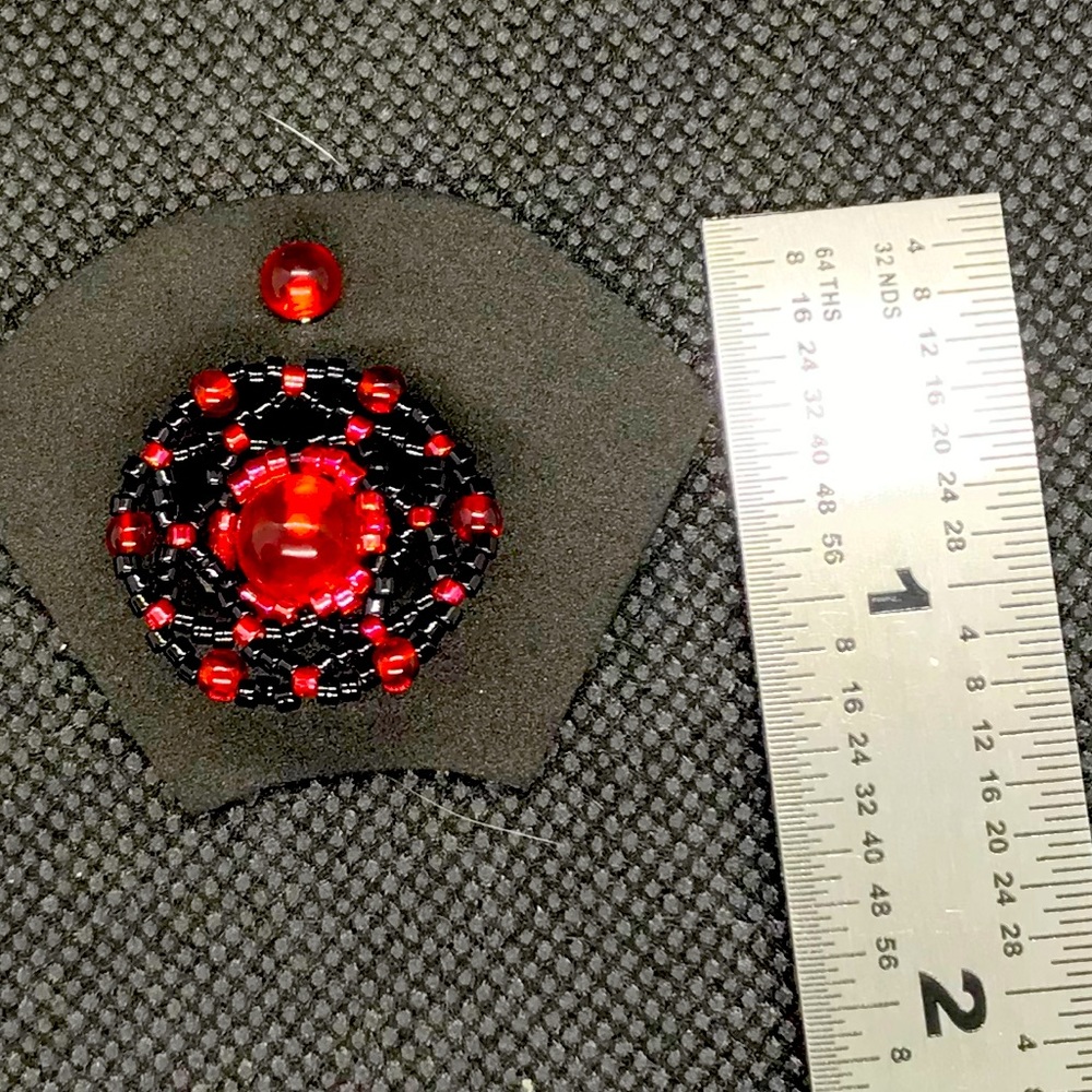 Flexible beaded belly ring/shield